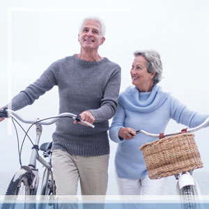 Happy senior couple riding bikes